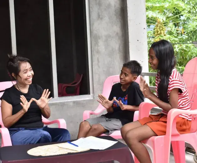 Community members from Timor Leste - mother and her children talking about dengue